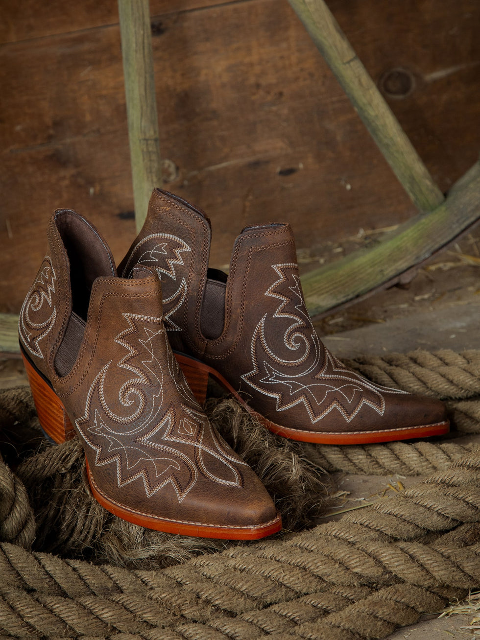 A pair of Durango CRUSH™ DRD0399 boots on a curled up rope